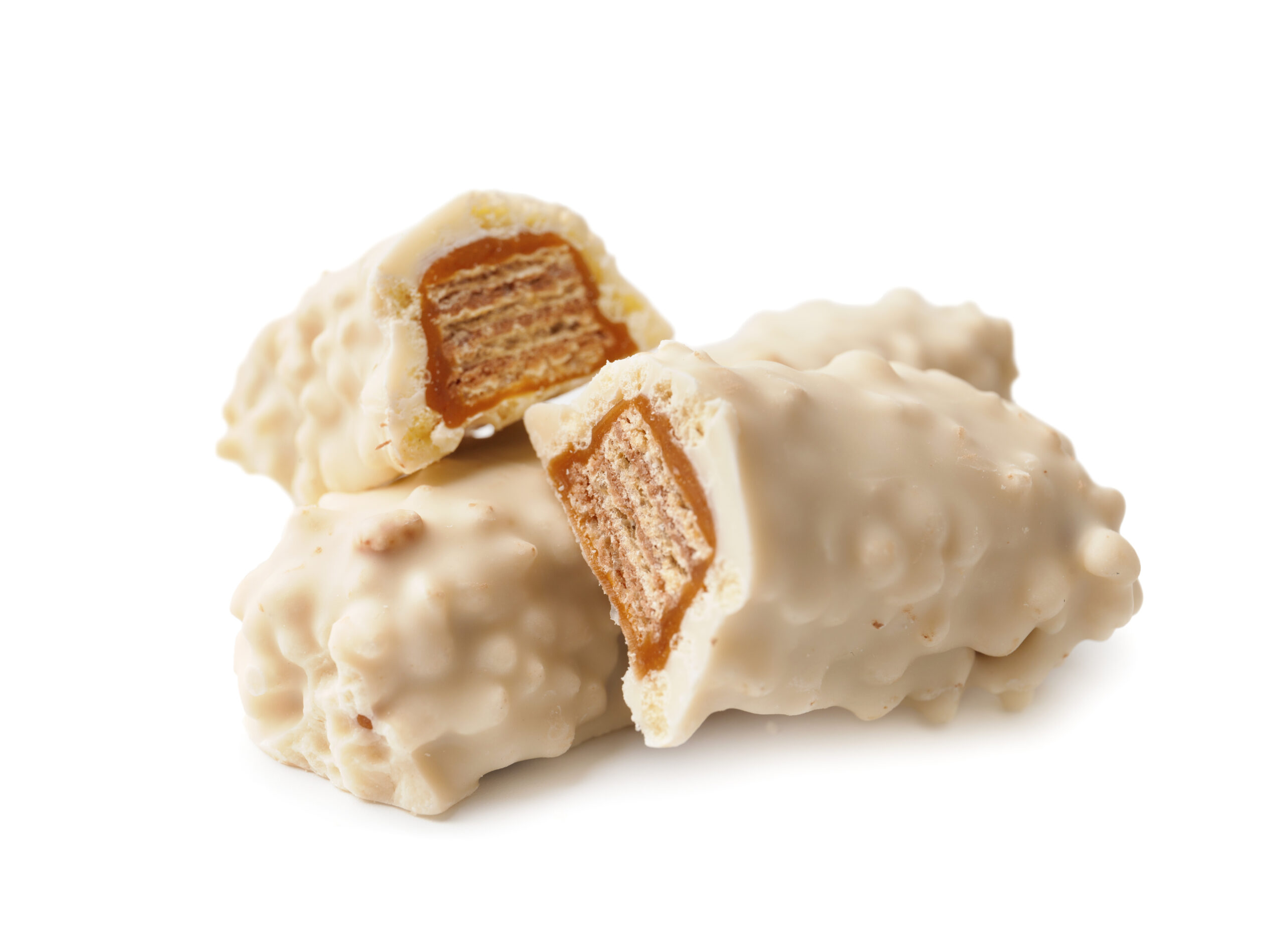 Broken and whole chocolate bar with crispy wafers and caramel in white chocolate close-up isolated on white background.